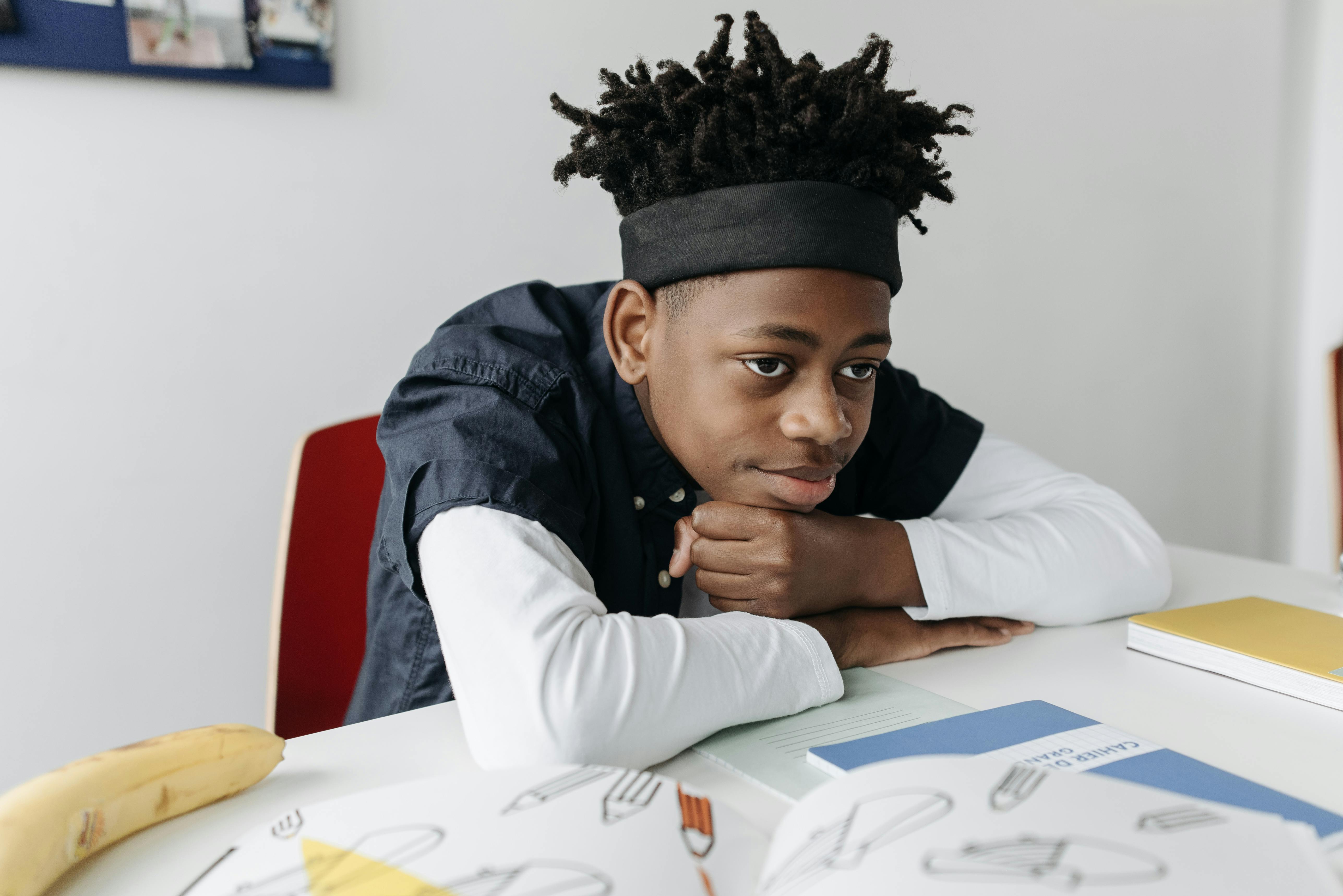 a boy sitting at the table