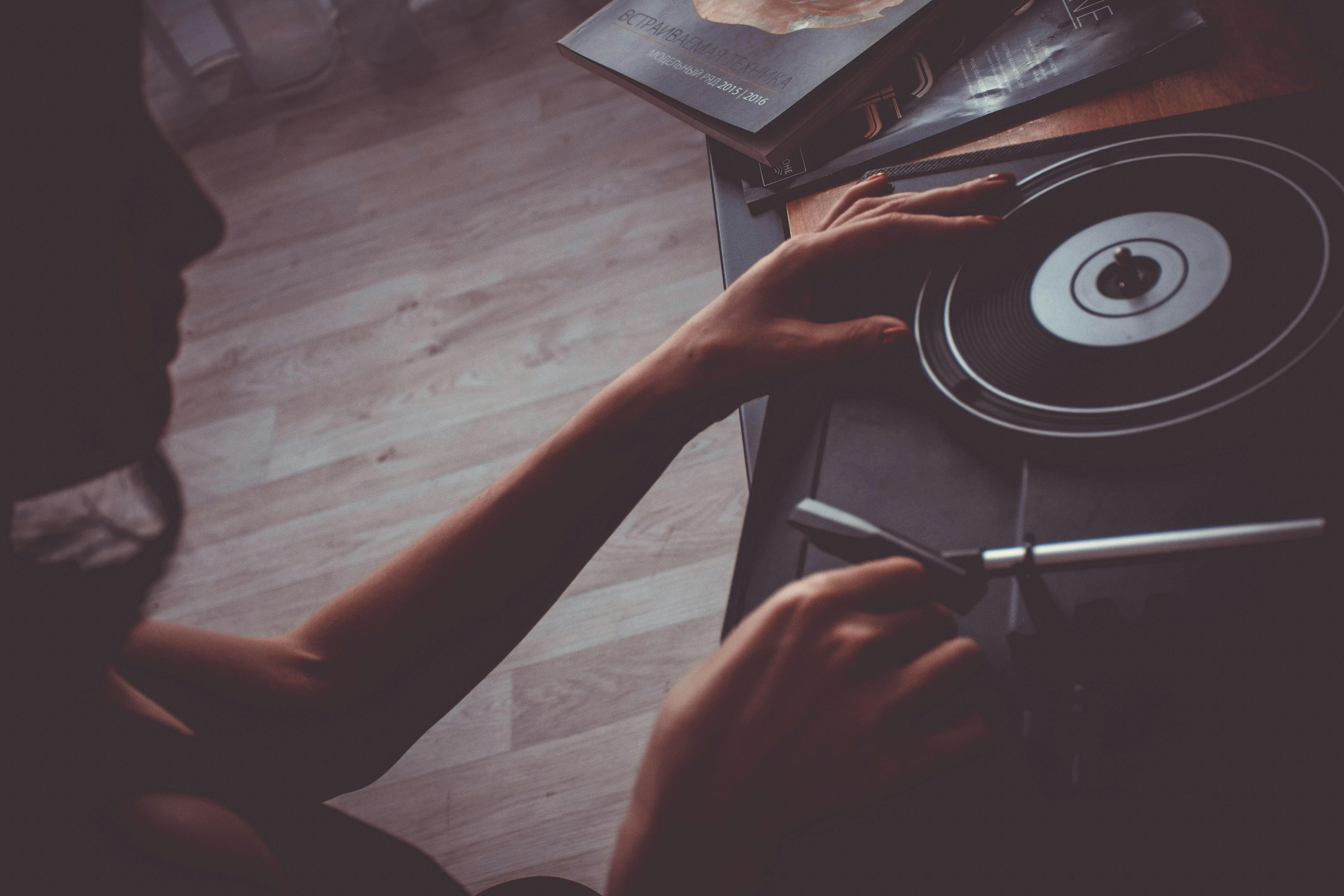 person holding a turntable