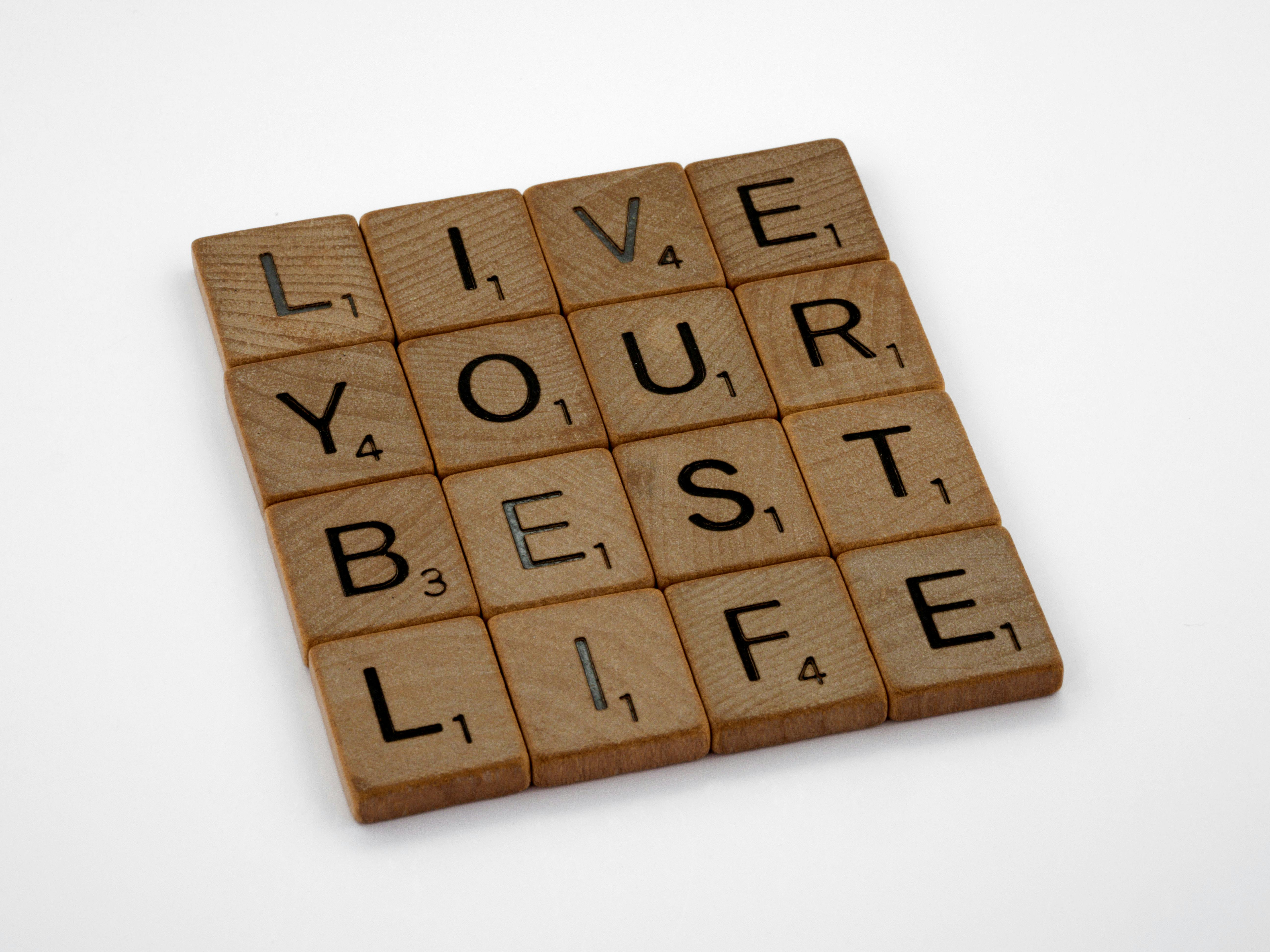 brown wooden letter blocks on white surface