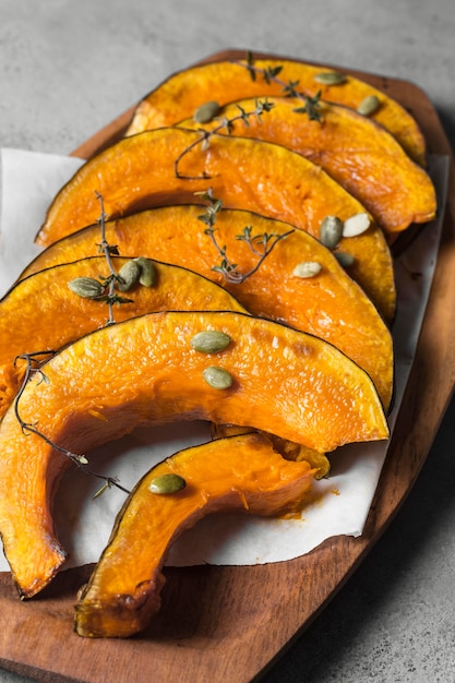 Free photo delicious baked pumpkin slices with seeds