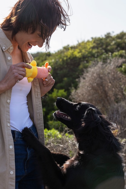 Free photo dog trainer interacting with their pet