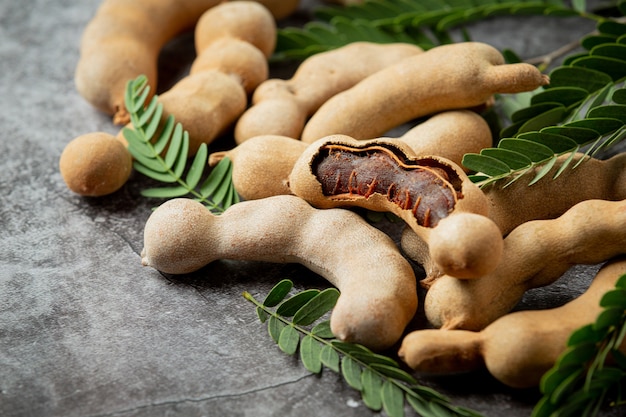 Free photo fresh sweet ripe tamarind on dark surface