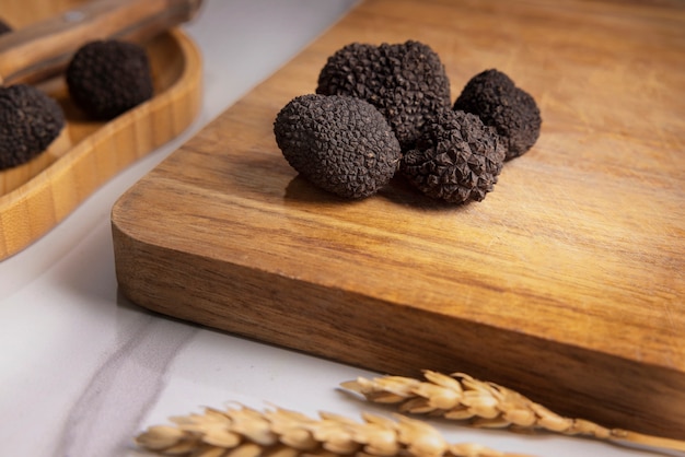 Free photo high angle truffles on wooden board