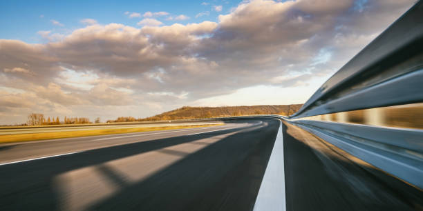 Race Car / motorcycle racetrack after rain on a sunny day. Fast motion blur effect. Ready to race Race Car / motorcycle racetrack after rain on a sunny day. Fast motion blur effect. Ready to race truffe prix stock pictures, royalty-free photos & images