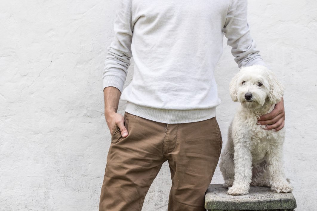 Man Posing With Dog